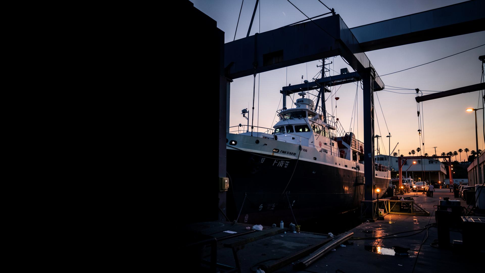 A large vessel in a Southern California marine yard at dawn